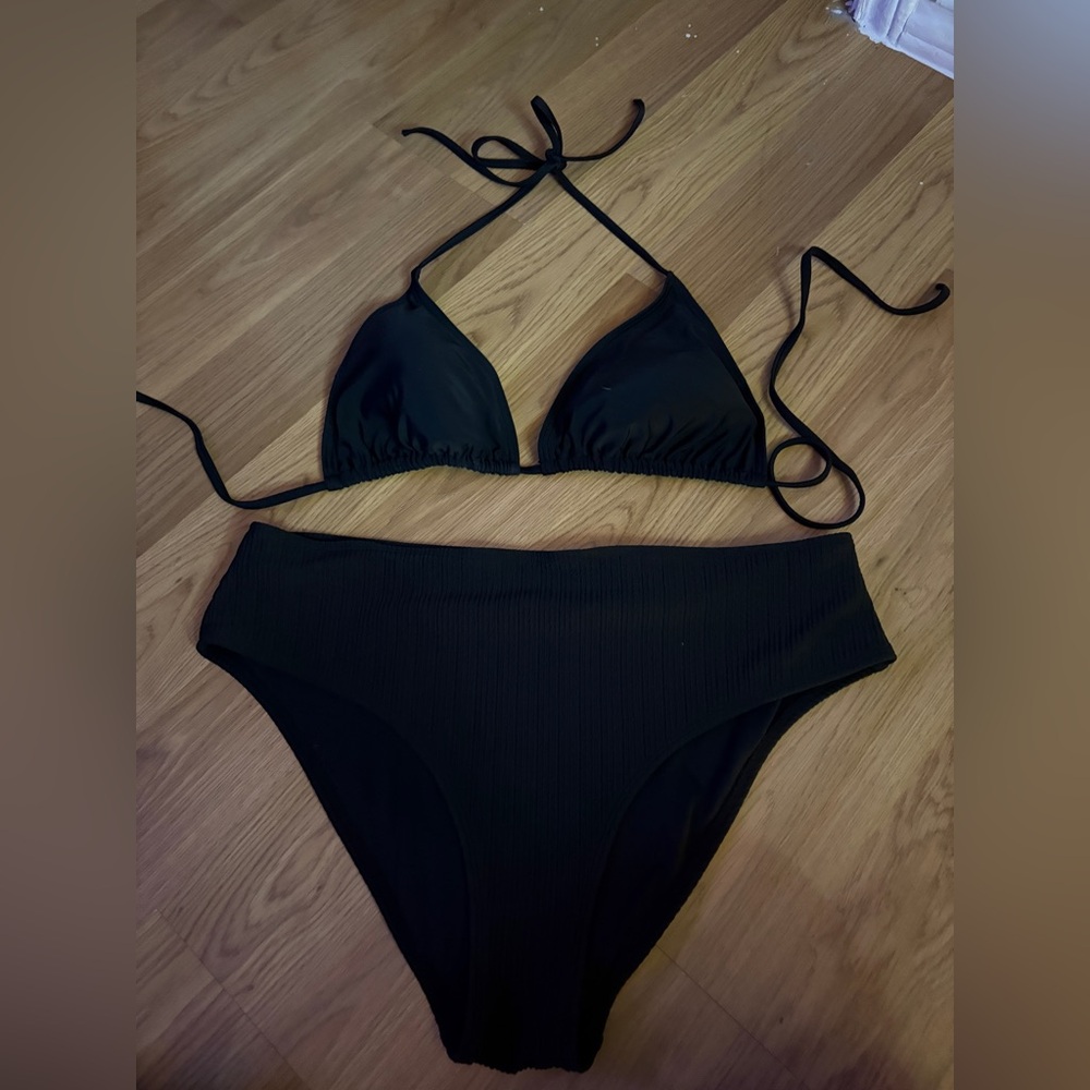 Neck tie top and high rise bottoms.